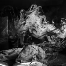 grayscale photo of woman in dress related to The Burning Bed: A Symbol of Resistance and Rebirth