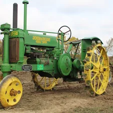 green and yellow tractor on brown field during daytime related to The Ultimate Guide to John Deere Valances: Elevating the Style of Your Farm Equipment