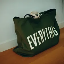 Green canvas bag with "everything" written on it. related to Finding the Best Deals on Bed in a Bag Queen Clearance