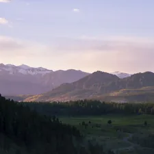 green grass valley between brown hills related to Charming Bed and Breakfasts in Colorado: Your Perfect Mountain Getaway