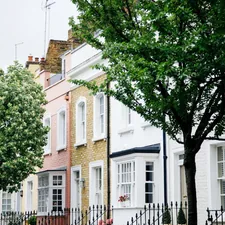 green trees in front of white and brown concrete building during daytime related to Elevate Your Home with London Shade Valance: A Guide