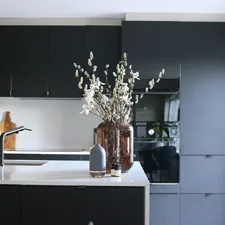 Grey volant diffuser and essential oils add ambiance and transform the kitchen into a relaxing environment. related to Elevate Your Kitchen Style with a Sophisticated Black Kitchen Sideboard