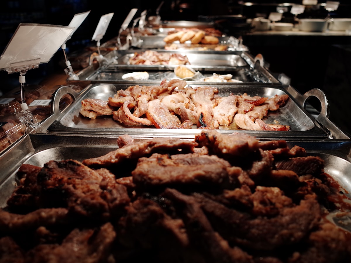 grilled meat on stainless steel tray related to Stylish Spaces: Elevating Your Buffet, Servers, and Sideboards