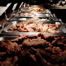 grilled meat on stainless steel tray related to Stylish Spaces: Elevating Your Buffet, Servers, and Sideboards
