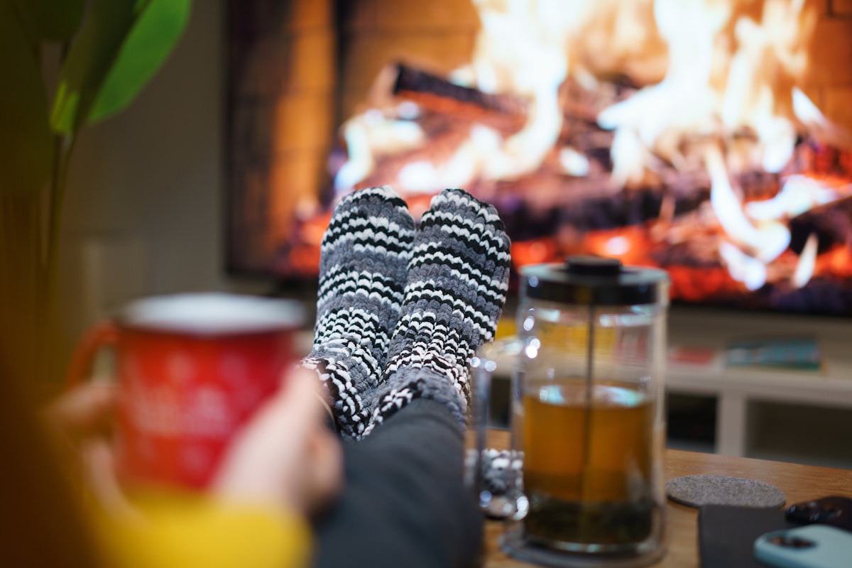 home fireplace tv screen sofa interior warm socks related to Experience the Cozy Side of B&B: Groupon Deals