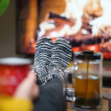 home fireplace tv screen sofa interior warm socks related to Experience the Cozy Side of B&B: Groupon Deals