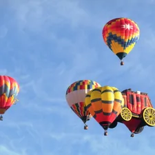Hot air balloon fly together with a blue sky. related to Elevate Your Nursery with Hot Air Balloon Baby Bedding