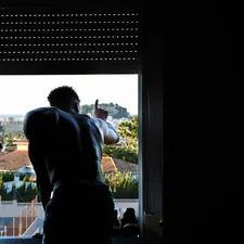 I was on a mission trip as a photographer with my universities basketball team in Spain. After one of our clinics with children from the community I was walking back to my room when I walked past and saw this individual hanging out the window, and had to get this shot. I told him to not move while I got my settings right, and it quickly became one of my favorite images from the trip. related to Elevate Your Window Game: A Guide to Valances