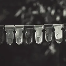 In frame - Cloth clips on a wire. related to Blinds & Valence Clips