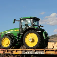 John Deere tractors on a train car in Pocatello, Idaho. related to Riding into Dreamland: The Coolest John Deere Tractor Bed