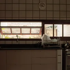 Kitchen counter with sink and window view. related to Kitchen Window Valance Ideas to Elevate Your Cooking Space