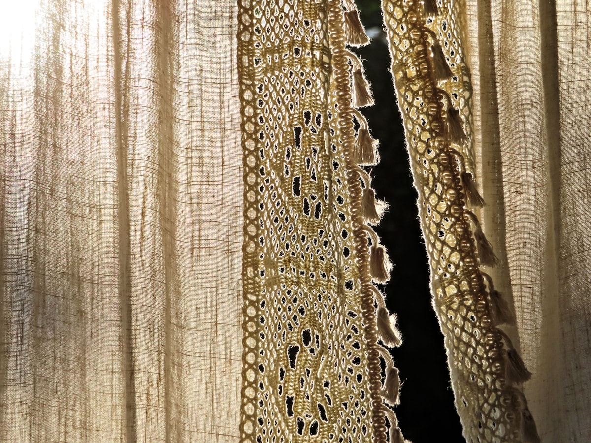 Lace edged curtain with tassels, backlit related to Lace Valances Window Treatments