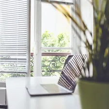 laptop on a desk related to Office Window Valances