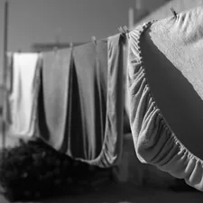 Laundry drying on a clothesline in the sun. related to Twin Size Coverlets