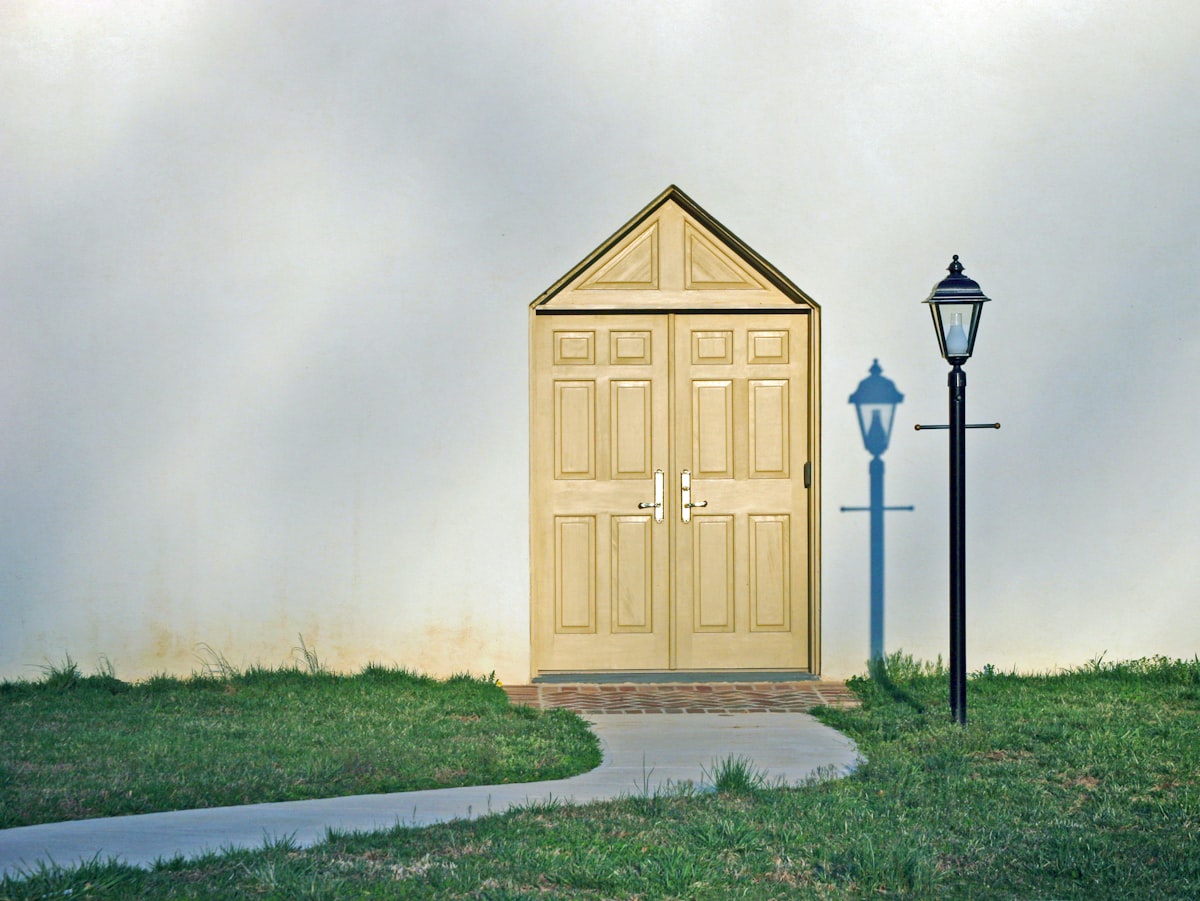 "Light Entry" --- A double-door entranceway with a lamppost and its shadow. related to Maximize Your Entryway's Potential with IKEA Storage