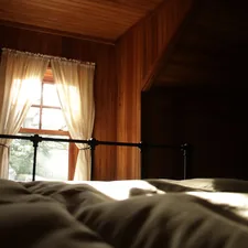 Light from a window being cast onto a soft bed. related to Sleep in Historic Charm: Bed & Breakfasts of Pennsylvania