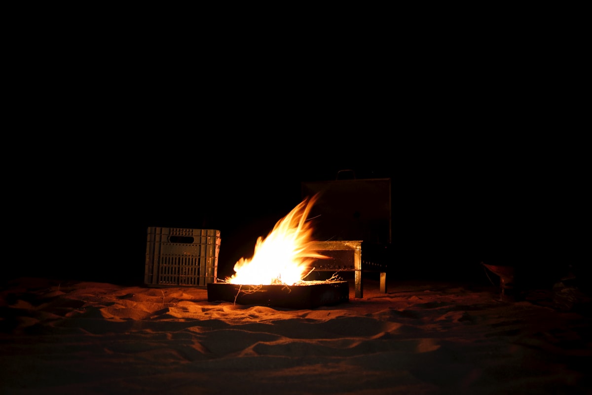 Lighting up a fire in the middle of the Adrar desert. related to Mending the Art of Outdoor Fire: Repairing Cracked Chimineas