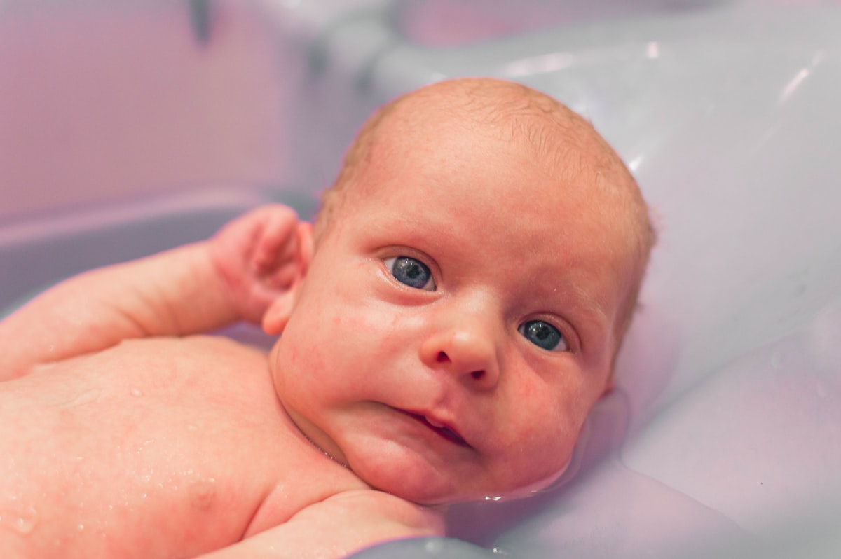 little newborn baby boy in baby bath for the first time related to Soft and Soothing Baby Blue Valance