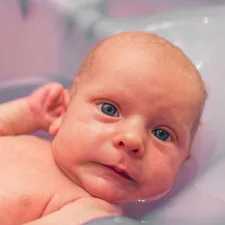little newborn baby boy in baby bath for the first time related to Soft and Soothing Baby Blue Valance