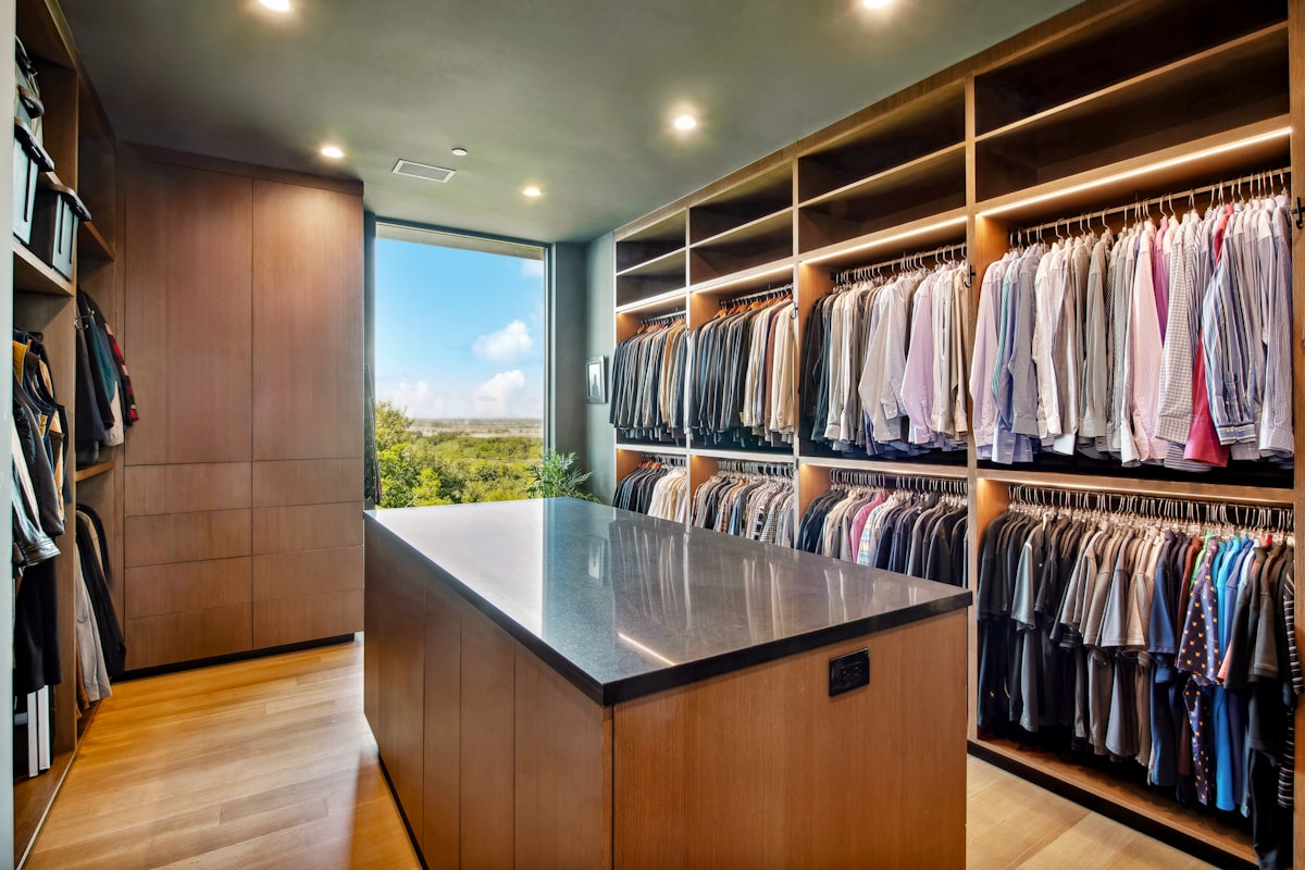 Luxurious walk-in closet with island and abundant clothing storage. related to Maximize Space and Style: The Full-Size Trundle Bed from IKEA