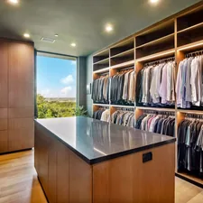 Luxurious walk-in closet with island and abundant clothing storage. related to Maximize Space and Style: The Full-Size Trundle Bed from IKEA