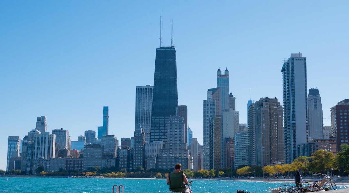 man and woman sitting on boat on water near city buildings during daytime related to How to Handle Bed Bugs in Michigan