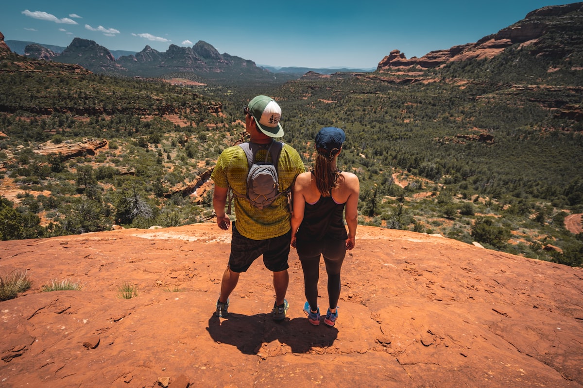 man and woman standing on hill related to From Crib to Big Kid Adventures: Your Guide to Delta Toddler Beds