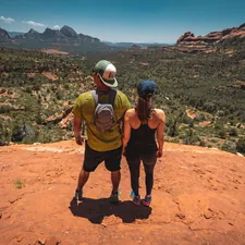 man and woman standing on hill related to From Crib to Big Kid Adventures: Your Guide to Delta Toddler Beds