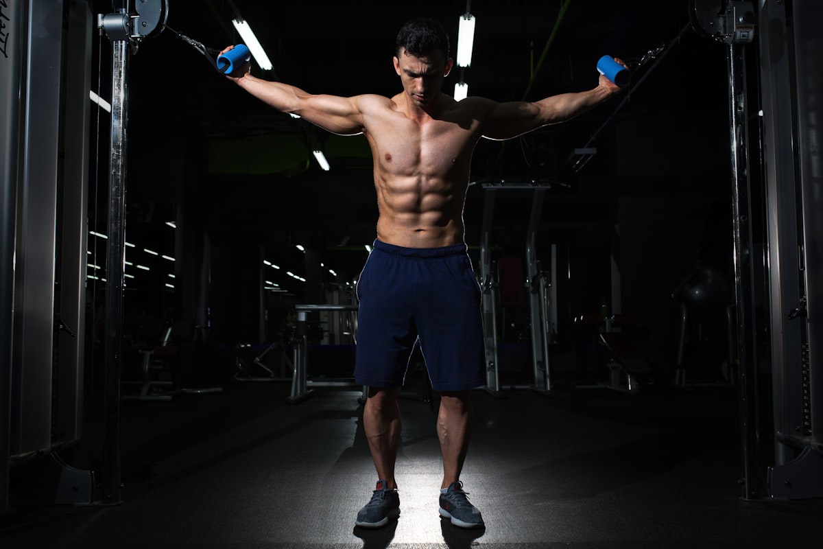 man exercising inside dim room related to The Perfect Chest for the End of Your Bed: Stylish and Functional Storage Solutions
