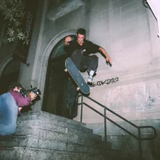 man in black t-shirt and blue denim jeans sitting on stairs related to How to Hang Swag Valances: A Step-by-Step Guide