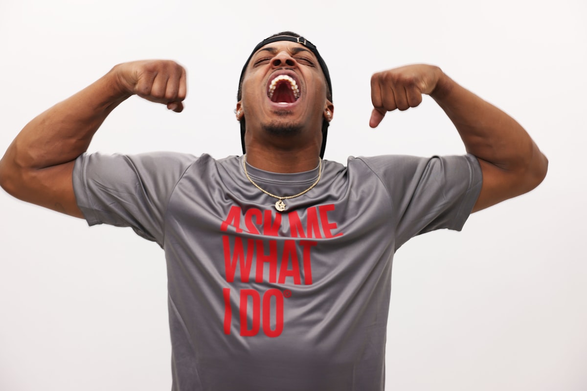 man in gray and red nike crew neck t-shirt related to Effective Strategies to Improve Endurance in Bed