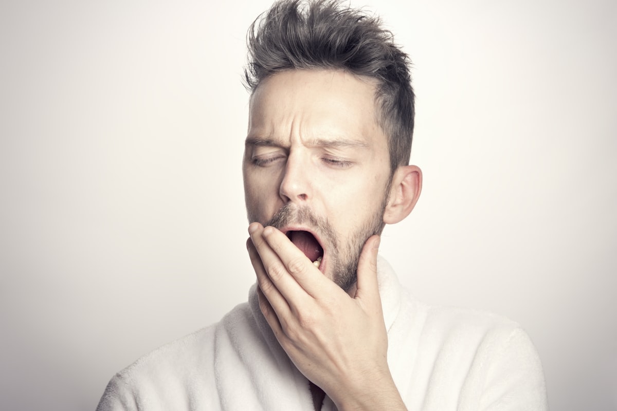 man in white long sleeve shirt related to Sleep Number Dreams: Unveiling the Mattress Price Tag