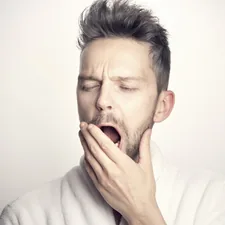 man in white long sleeve shirt related to Sleep Number Dreams: Unveiling the Mattress Price Tag
