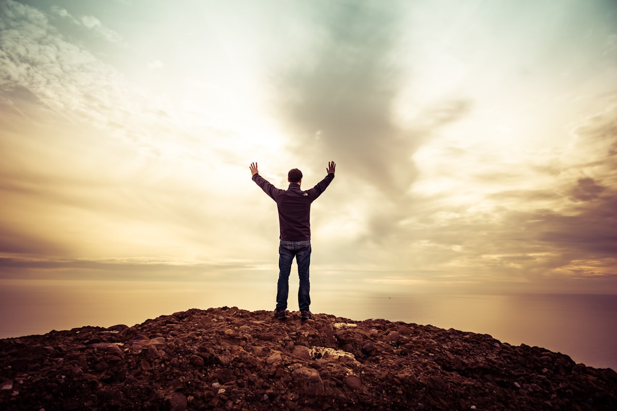 man standing under orange sky related to Rising to the Challenge: All About Fire Truck Valances