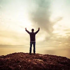 man standing under orange sky related to Rising to the Challenge: All About Fire Truck Valances