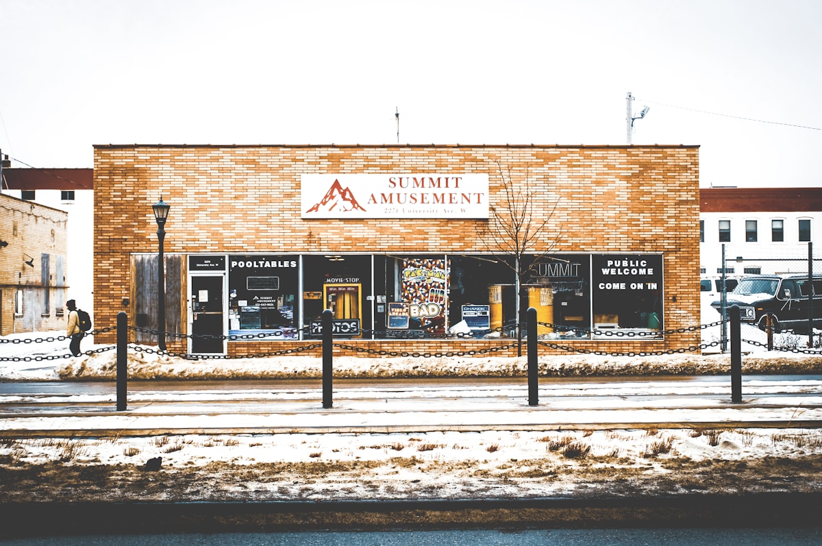 man walking infront of store front related to Discover the Best Bed and Breakfasts in Minnesota