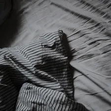 Messy bed related to Black and White Coverlet: The Perfect Blend of Elegance