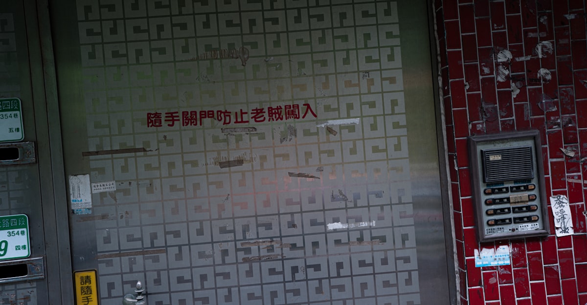 Metal door covered in small square labels and a keypad. related to Stunning Entryway Makeover with the Perfect Tiles