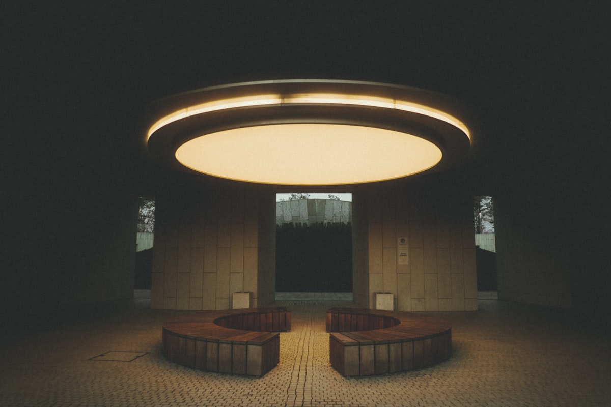 Modern circular seating area with overhead light related to Elevating Your Home's First Impression: A Guide to Entryway Ceiling Lights