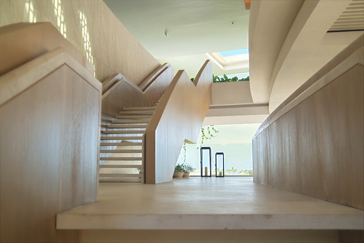 Modern interior with a grand staircase and natural light. related to Smart Solutions for Kids' Bedrooms
