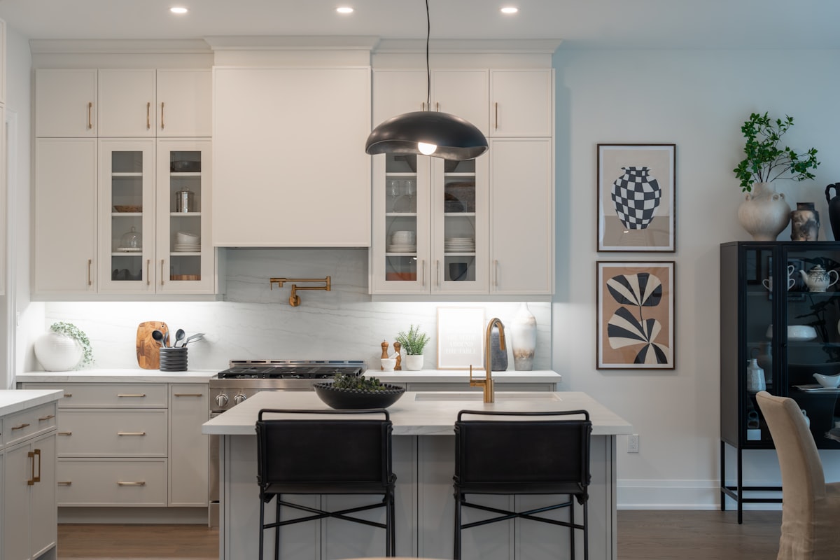 Modern kitchen with island and pendant light. related to Elevate Your Kitchen Style with Modern Kitchen Valances