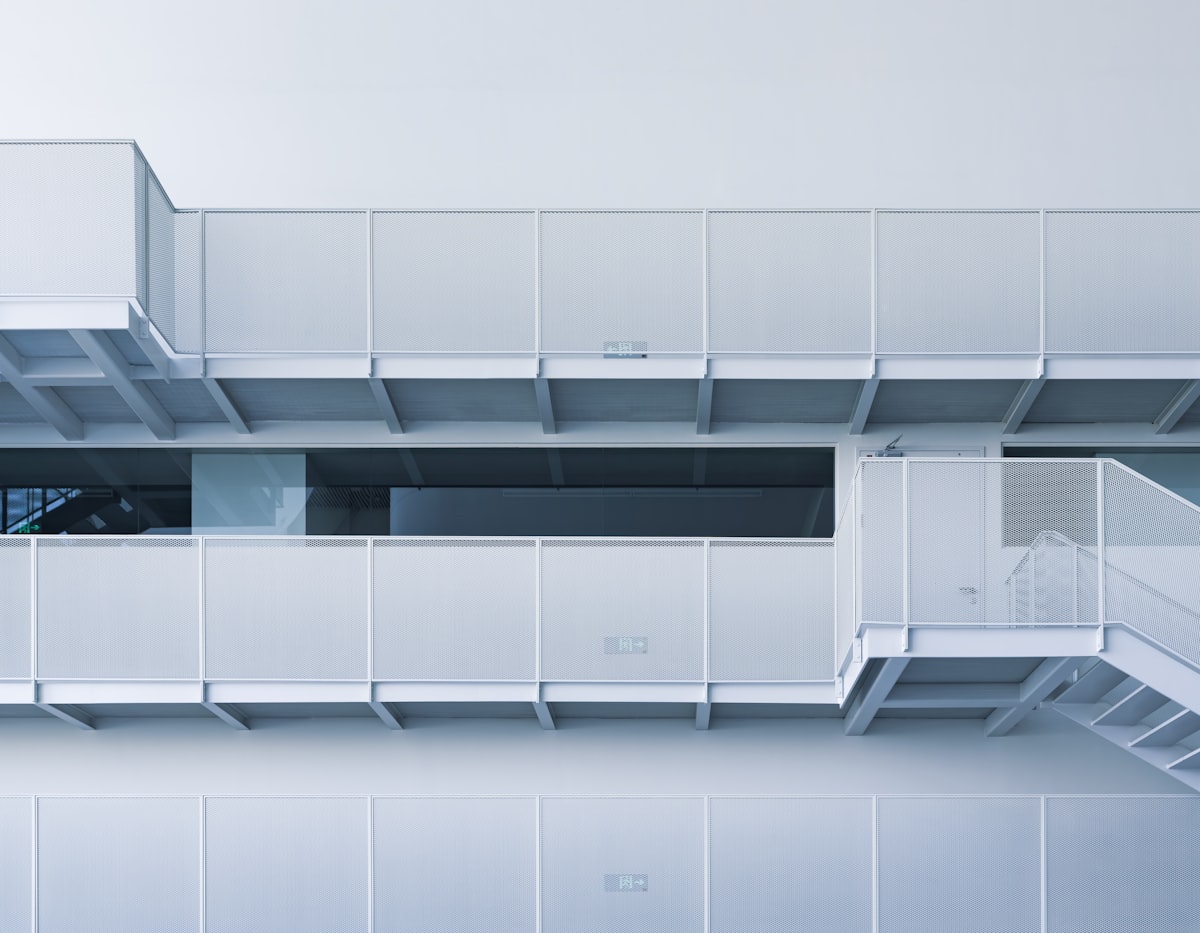 Modern white building with balconies and stairs related to Elegant Loft Beds with Stairs for Modern Bedrooms