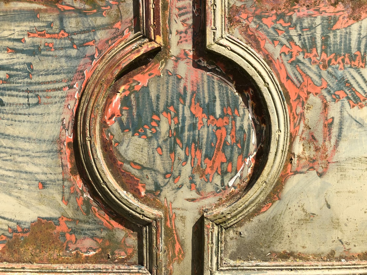 Motive on old iron gateway beeing restored related to The Timeless Appeal of a Distressed Pine Sideboard