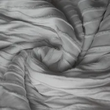 Neatly curled fabric folds in a circle related to White Quilted Coverlet King