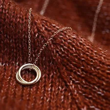 necklace on waves of fabric related to Cozying Up with Style: The Charm of Brown Quilted Coverlets