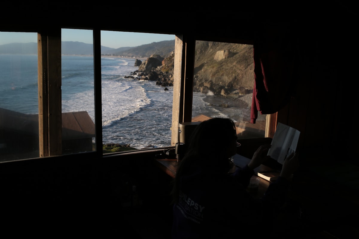 Ocean waves crash on a rocky coastline viewed from window related to Discover the Charm of Bed and Breakfasts in Eureka, CA
