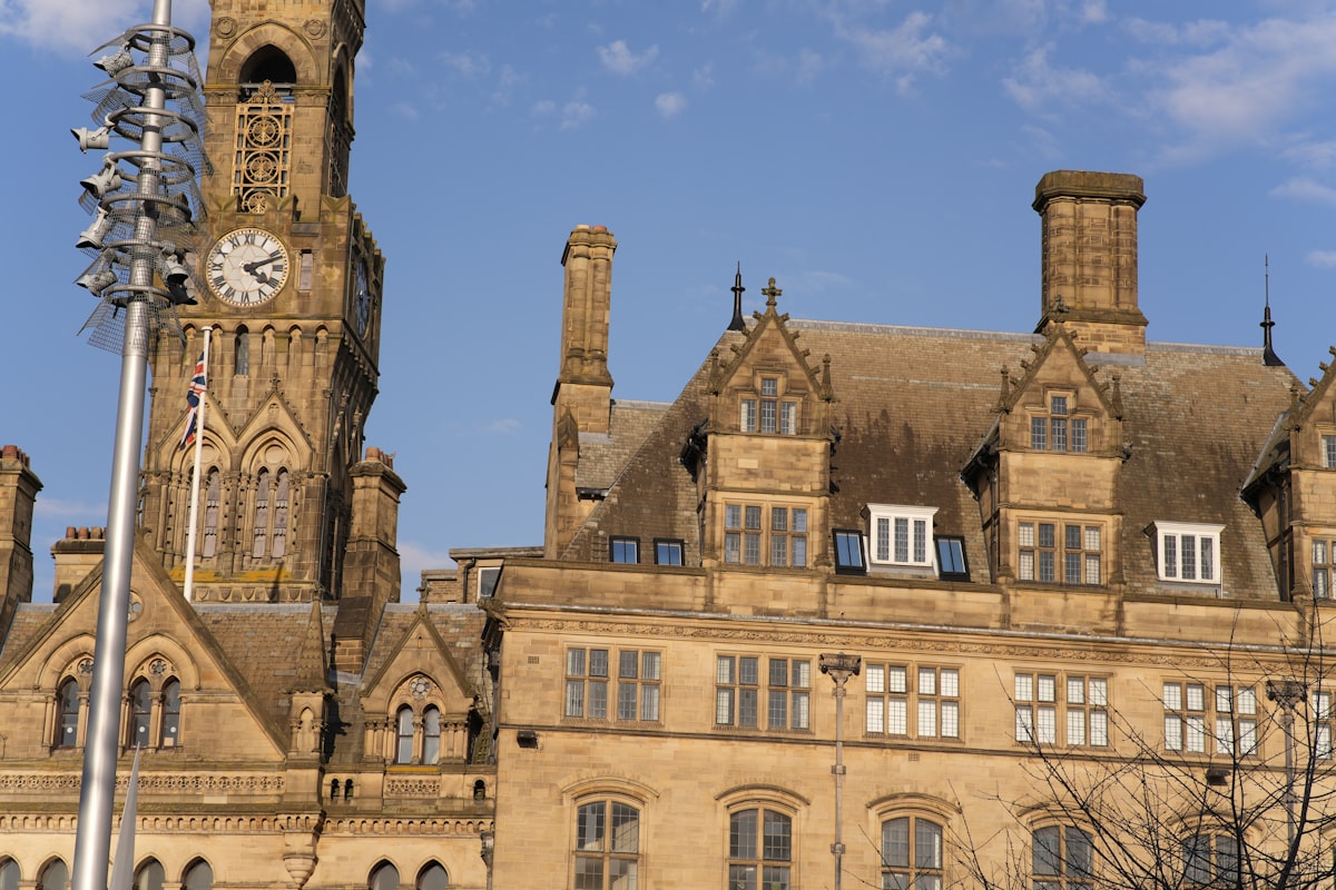 Old building with a clock tower against blue sky. related to The Ultimate Guide to Bradford Truck Beds