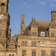 Old building with a clock tower against blue sky. related to The Ultimate Guide to Bradford Truck Beds