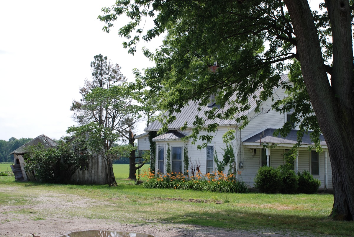 Old white farm house and collapsing barn related to Experience the Best of Ohio Bed and Breakfast