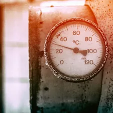 orange and white analog gauge related to Understanding the Costs of Heat Treatment for Bed Bugs